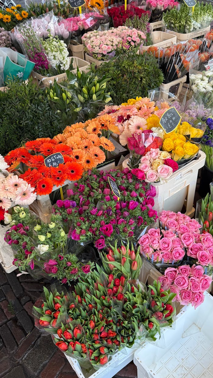 Vibrant assortment of fresh flowers at a bustling outdoor market, showcasing nature's beauty in vivid colors.